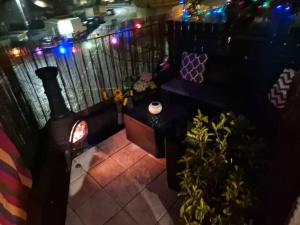 an overhead view of a balcony with a heater and plants at Beach front apartment in Edinburgh