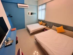 Uma cama ou camas num quarto em 澎湖樂在綺中民宿 第580號