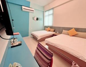Uma cama ou camas num quarto em 澎湖樂在綺中民宿 第580號
