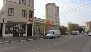 a white van parked on the side of a street at Hotel Nikea in Kutaisi