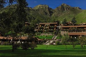 a resort with mountains in the background at Rio Sagrado, A Belmond Hotel, Sacred Valley in Urubamba