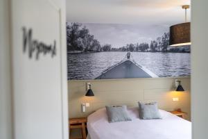 Postel nebo postele na pokoji v ubytování Hotel De Maretak