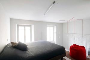 Katil atau katil-katil dalam bilik di Appartamenti i Colori