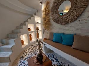 a living room with a bench and a mirror at OMA WATU DOME VILLAS in Pacitan