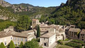 an aerial view of a village in the mountains at Charmante suite indépendante avec cave à vin in Cournonsec