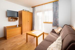 TV a/nebo společenská místnost v ubytování Apartment Wanger