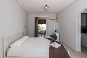 A bed or beds in a room at Odysseas Studios