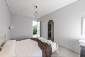 A bed or beds in a room at Odysseas Studios