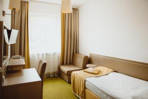 Postel nebo postele na pokoji v ubytování Arche Hotel Siedlce