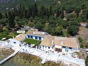 an aerial view of a house on the water at Nissaki Olive Press Villas in Nisakion