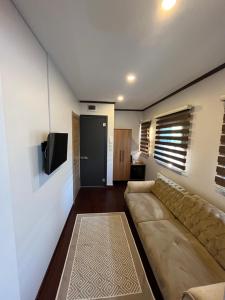 A television and/or entertainment centre at PALMERA ART HOUSE