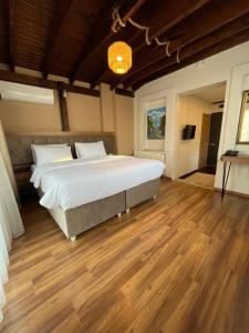 A bed or beds in a room at PALMERA ART HOUSE
