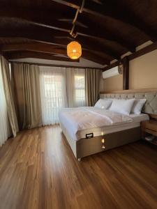 A bed or beds in a room at PALMERA ART HOUSE