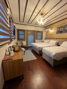 A bed or beds in a room at PALMERA ART HOUSE