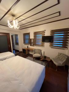 A bed or beds in a room at PALMERA ART HOUSE