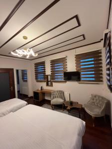 A bed or beds in a room at PALMERA ART HOUSE