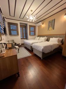 A bed or beds in a room at PALMERA ART HOUSE