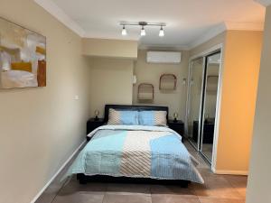 a bedroom with a bed in a room at One bedroom studio in North Tamborine
