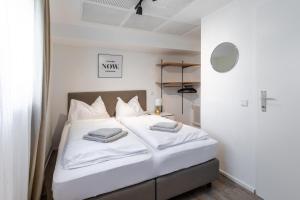 Łóżko lub łóżka w pokoju w obiekcie Appartements DAS RETTENBACHER