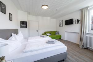 Łóżko lub łóżka w pokoju w obiekcie Appartements DAS RETTENBACHER
