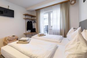 Łóżko lub łóżka w pokoju w obiekcie Appartements DAS RETTENBACHER