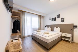 Łóżko lub łóżka w pokoju w obiekcie Appartements DAS RETTENBACHER