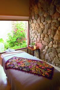 Ένα ή περισσότερα κρεβάτια σε δωμάτιο στο Rio Sagrado, A Belmond Hotel, Sacred Valley