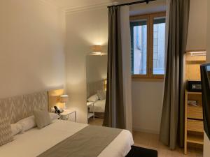 A bed or beds in a room at Sóller Center