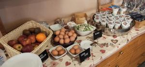 a table with baskets of fruits and vegetables on it at Hotel Alpechiara in Pré-Saint-Didier