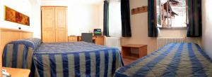 Postel nebo postele na pokoji v ubytování Hotel Alpechiara