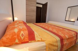Postel nebo postele na pokoji v ubytování Apartman Karaga