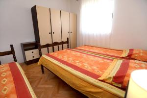 Postel nebo postele na pokoji v ubytování Apartman Karaga