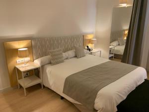 A bed or beds in a room at Sóller Center