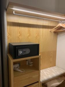 a small tv sitting on a shelf in a closet at Sóller Center in Sóller