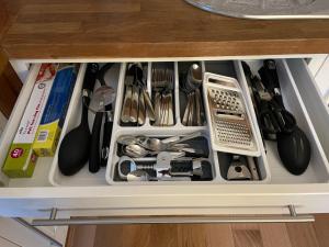 a drawer filled with lots of kitchen utensils at Flat 2, Ty Newydd in Barmouth