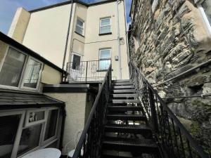 a stairway leading up to a building at Flat 2, Ty Newydd in Barmouth