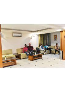 a group of people sitting in a living room at Shining star in Bodh Gaya