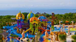 a large water park with a water slide at Baik Baik Homestay in Uluwatu
