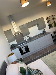 a kitchen with a sink and a counter top at Studio Apartment Harlow in Potter Street