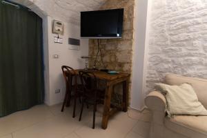 TV a/nebo společenská místnost v ubytování B&B La Torretta