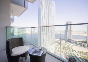 a room with a view of a city from a building at Nasma Luxury Stays - The Grand, Dubai Creek Harbour in Dubai
