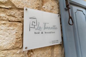 Certifikát, hodnocení, plakát nebo jiný dokument vystavený v ubytování B&B La Torretta