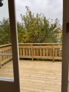 an open door to a deck with a fence at The Studio in Stockholm