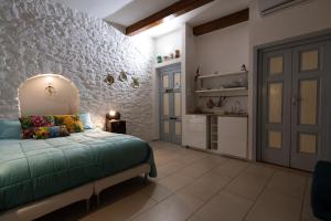 Postel nebo postele na pokoji v ubytování B&B La Torretta