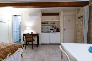 Kuchyň nebo kuchyňský kout v ubytování B&B La Torretta