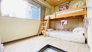 A bed or beds in a room at GUEST HOUSE B's FiveⅡ