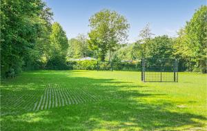 a field with two soccer goals in a park at Stunning Home In Scherpenisse in Scherpenisse +22 photos