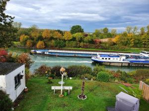 a view of a river with a boat in the water at Haus KanaleGrande in Haltern