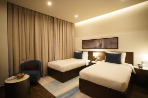 Gulta vai gultas numurā naktsmītnē C - Hotel and Suites Doha