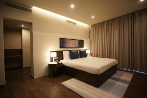 Gulta vai gultas numurā naktsmītnē C - Hotel and Suites Doha